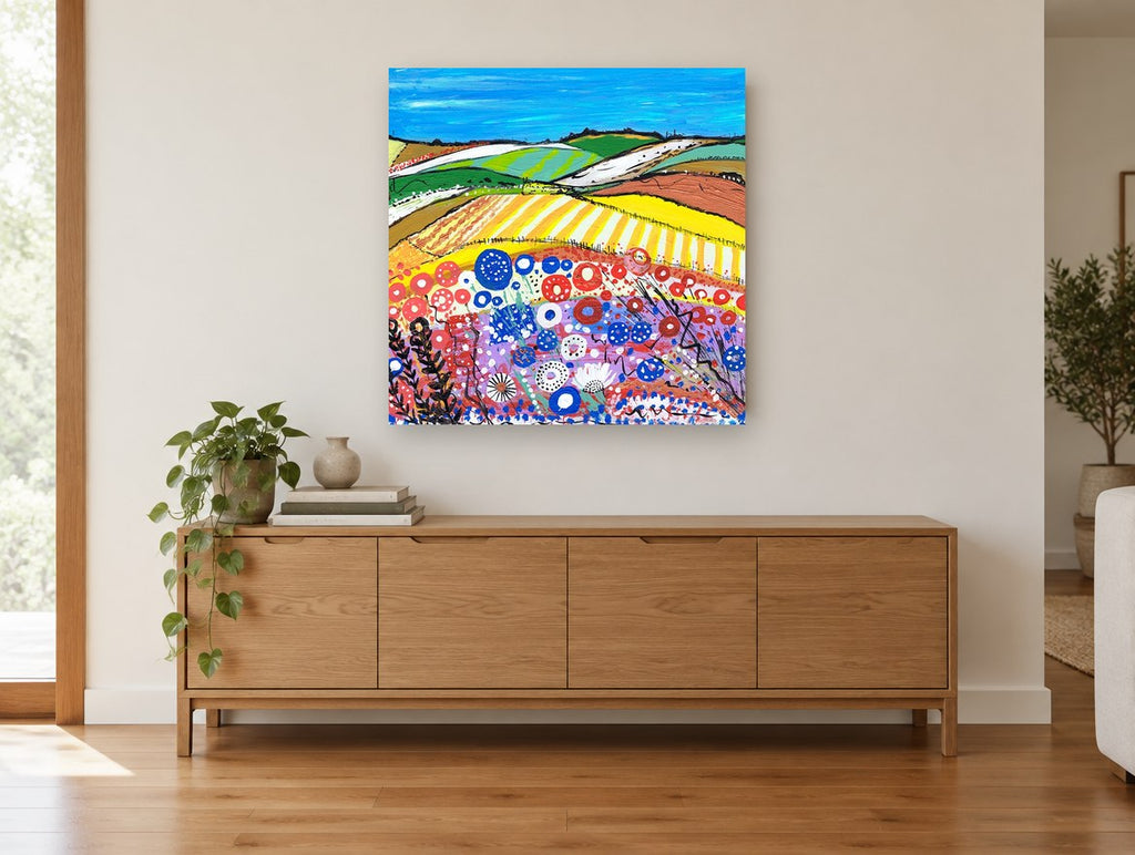 Poppy Meadow Stripes landscape canvas print on the wall of a living room above a sideboard