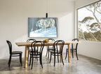 White Wolf in Snow landscape canvas print on the wall of a dining room
