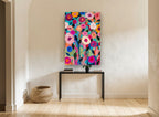 Bright Garden Bloom Chorus floral canvas print on the wall of a hallway