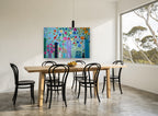 Vases in Bloom floral canvas print on the wall of a dining room