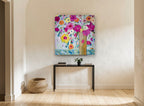 Bright Blooms Tall Vase floral canvas print on the wall of a hallway