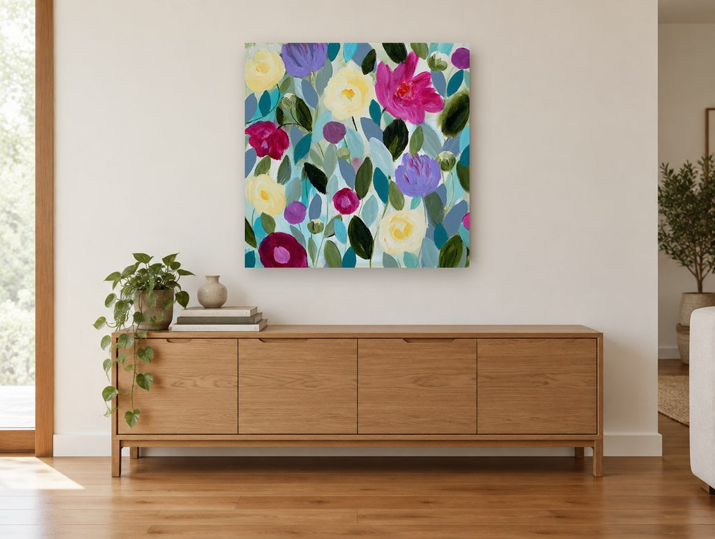 Garden of Soft Blooms floral canvas print on the wall of a living room above a sideboard