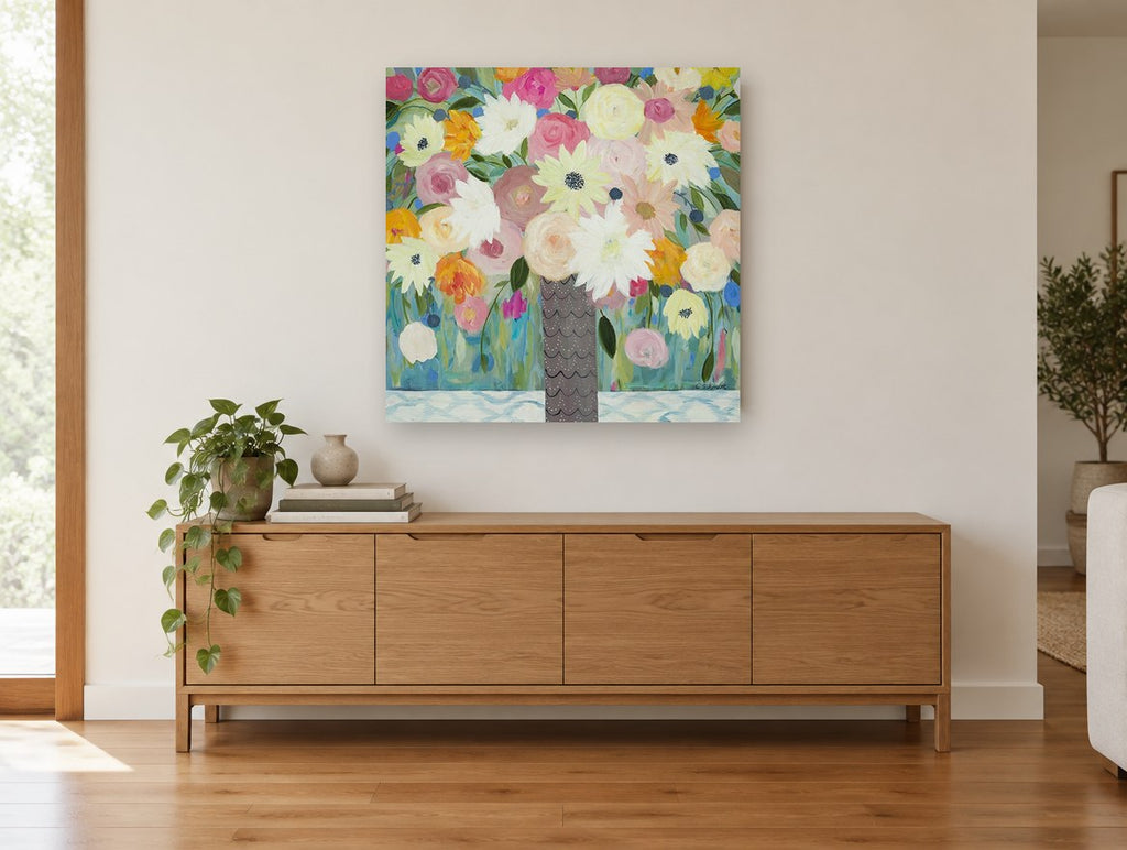 Scalloped Vase Bouquet floral canvas print on the wall of a living room above a sideboard