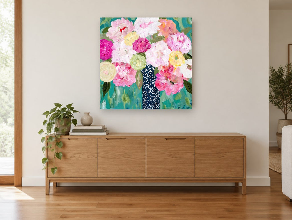 Swirl Vase Peonies floral canvas print on the wall of a living room above a sideboard