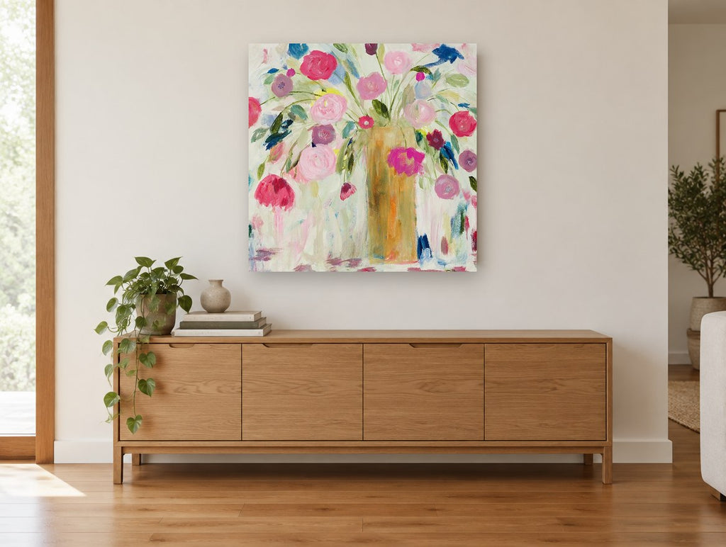 Loose Pink Bouquet floral canvas print on the wall of a living room above a sideboard