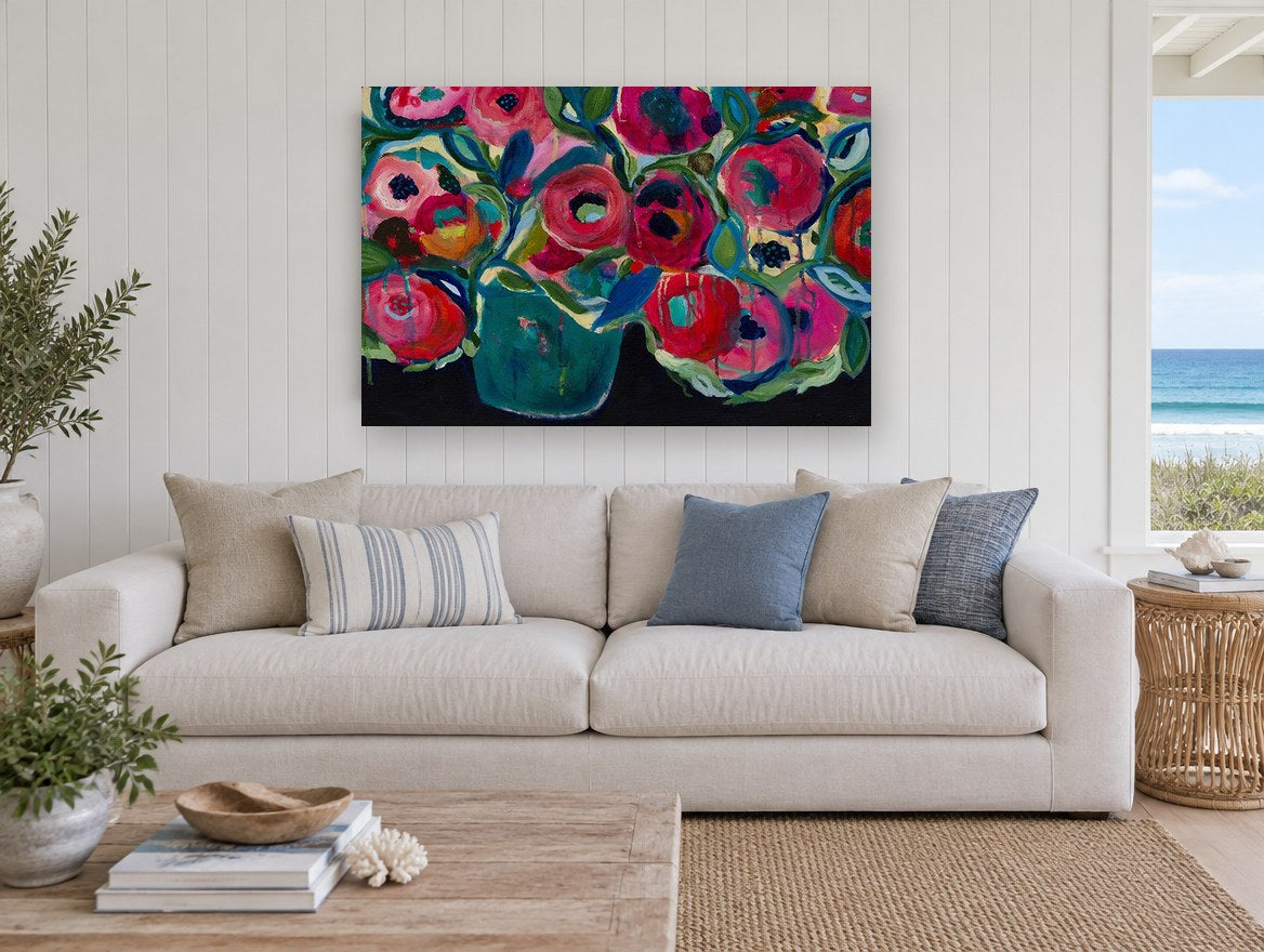 Crimson Poppies in Teal floral canvas print on the wall of a beach house living room