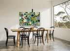 Garden of Round Blooms floral canvas print on the wall of a dining room