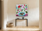 Pink Blooms in Turquoise Bowl floral canvas print on the wall of a hallway