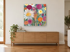 Garden at First Light floral canvas print on the wall of a living room above a sideboard