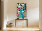 Teal Vase Garden floral canvas print on the wall of a hallway