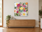 Garden of Daisies and Peonies floral canvas print on the wall of a living room above a sideboard