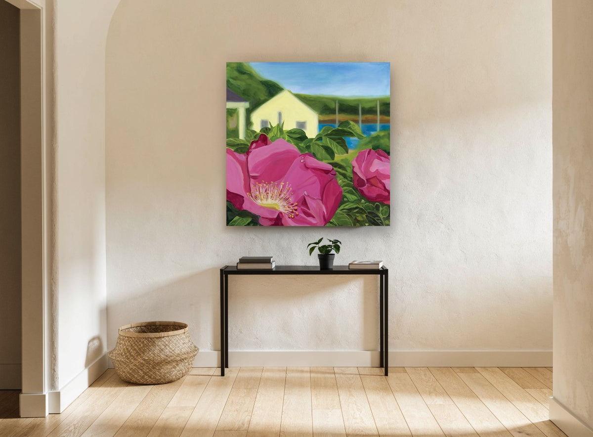 Beach Rose Cottage coastal canvas print on the wall of a hallway