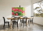 Hanging Pink Hearts floral canvas print on the wall of a dining room