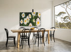 Daisies in Dark Grass floral canvas print on the wall of a dining room