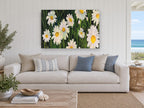 Daisies in Dark Grass floral canvas print on the wall of a beach house living room