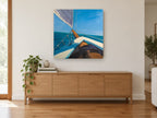 Bow Over Blue Water coastal canvas print on the wall of a living room above a sideboard
