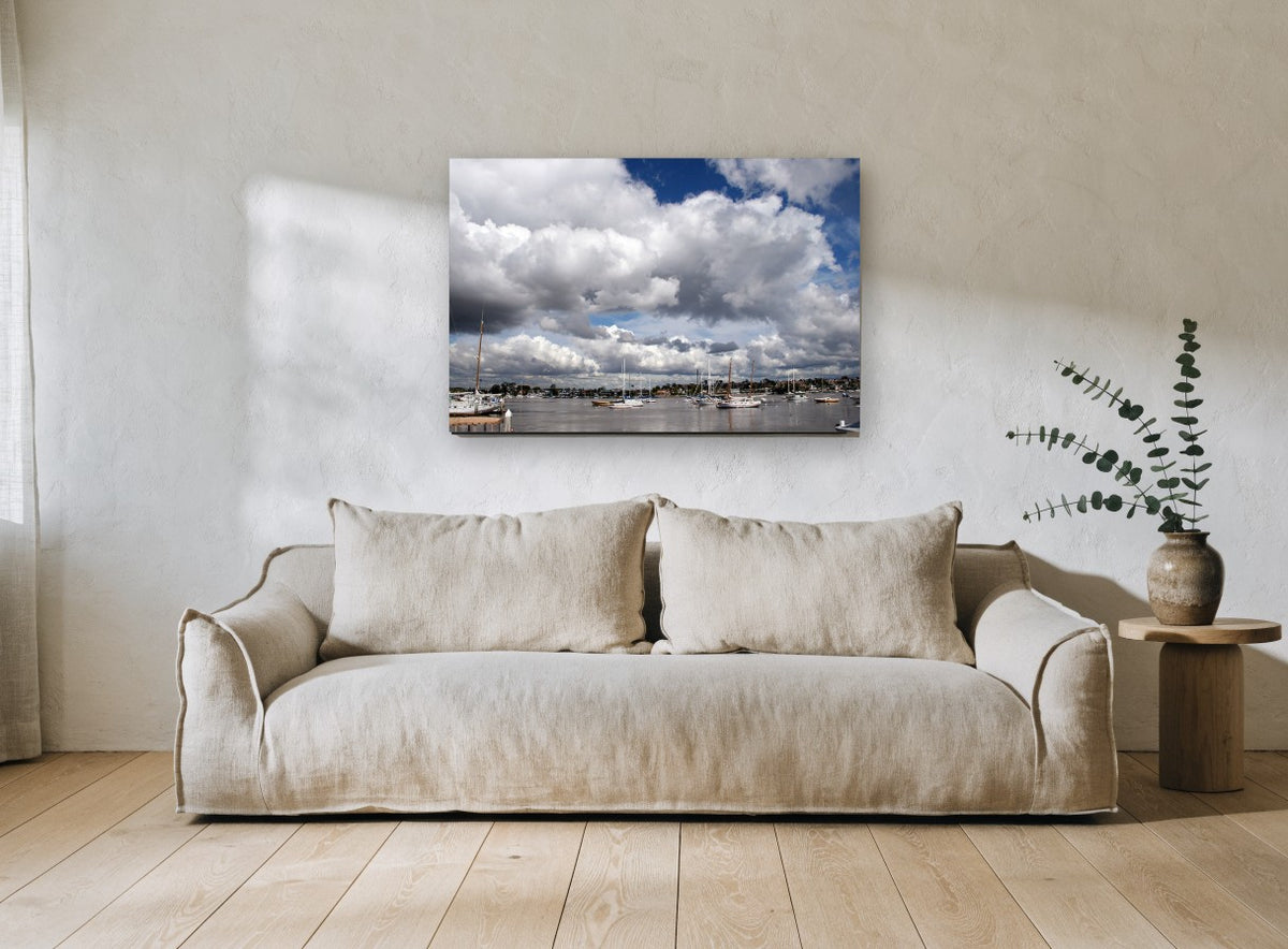 Harbour Under Cumulus coastal canvas print on the wall of a living room