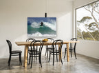 Surfer Carving the Lip coastal canvas print on the wall of a dining room