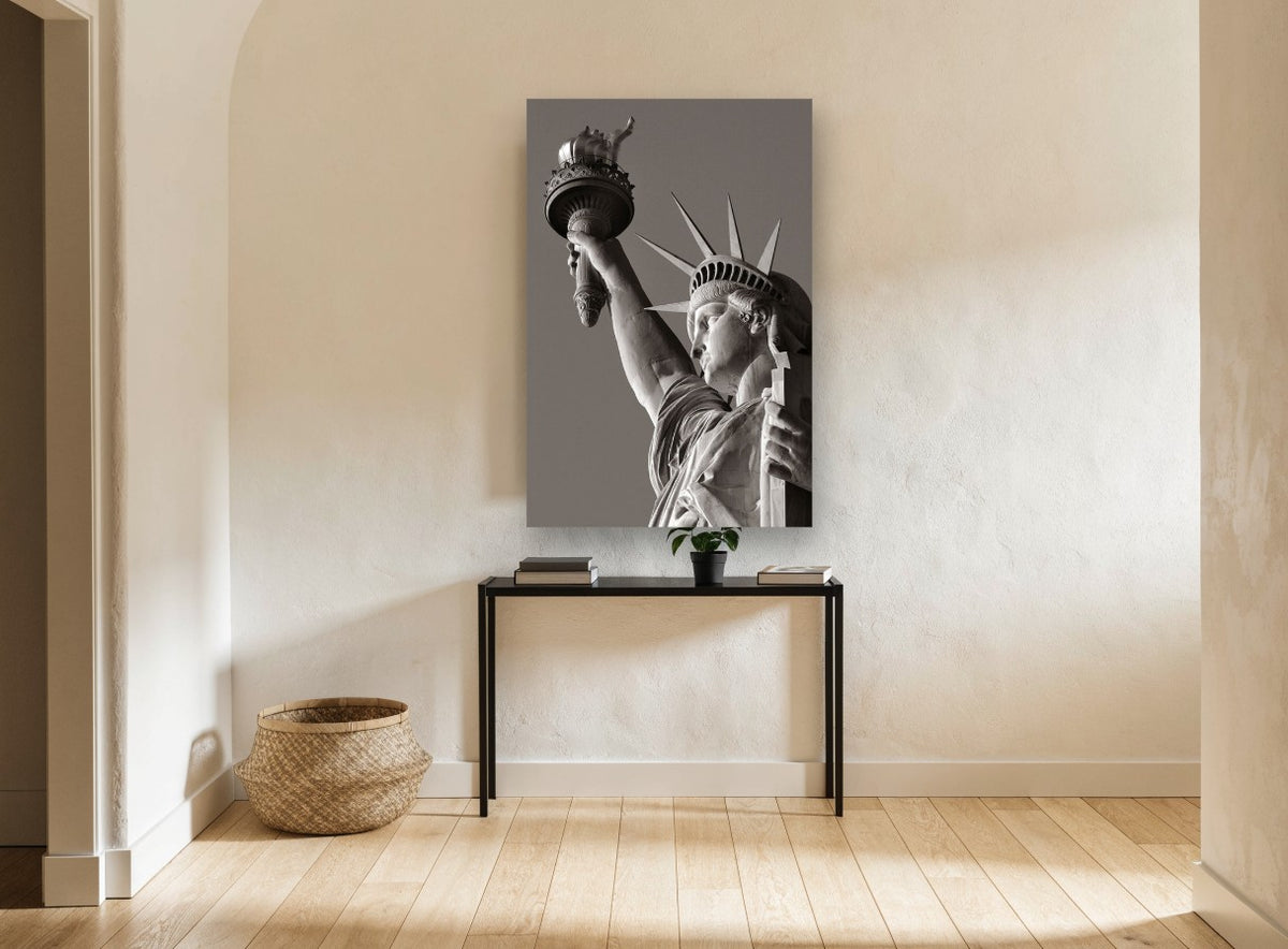 Liberty Raised Torch city canvas print on the wall of a hallway