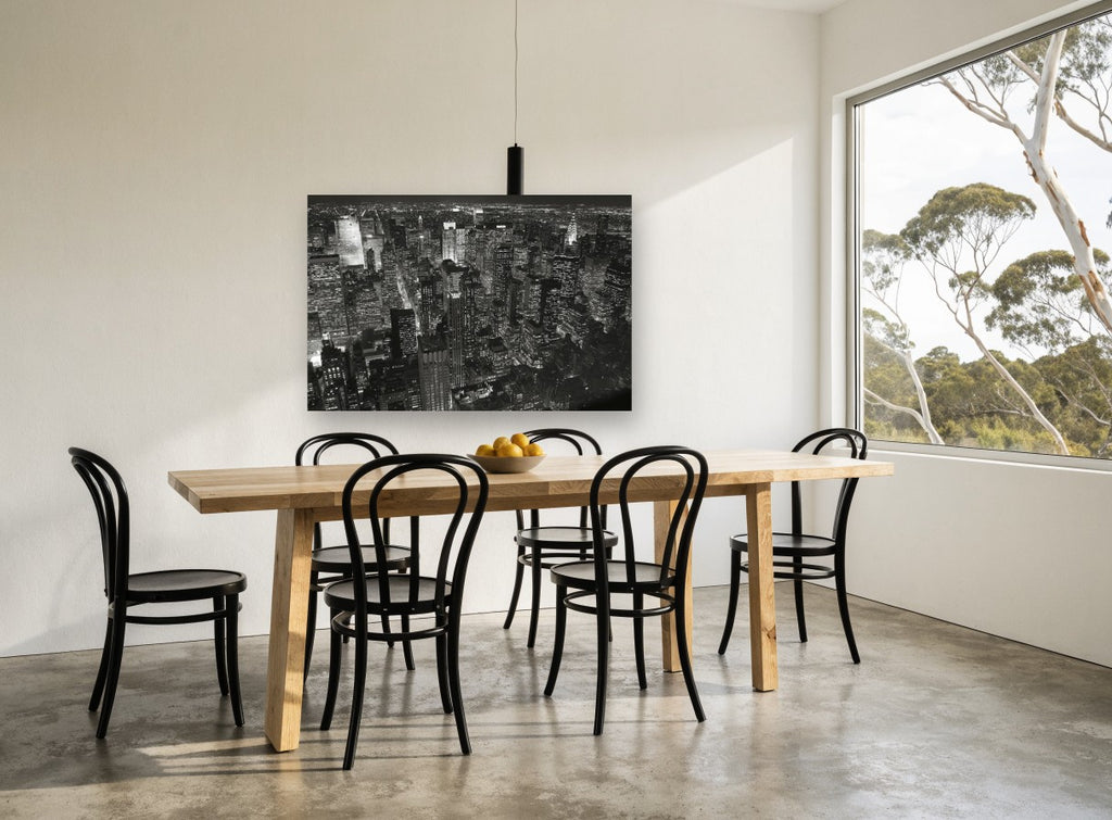 Midtown Monochrome Manhattan Glow city canvas print on the wall of a dining room