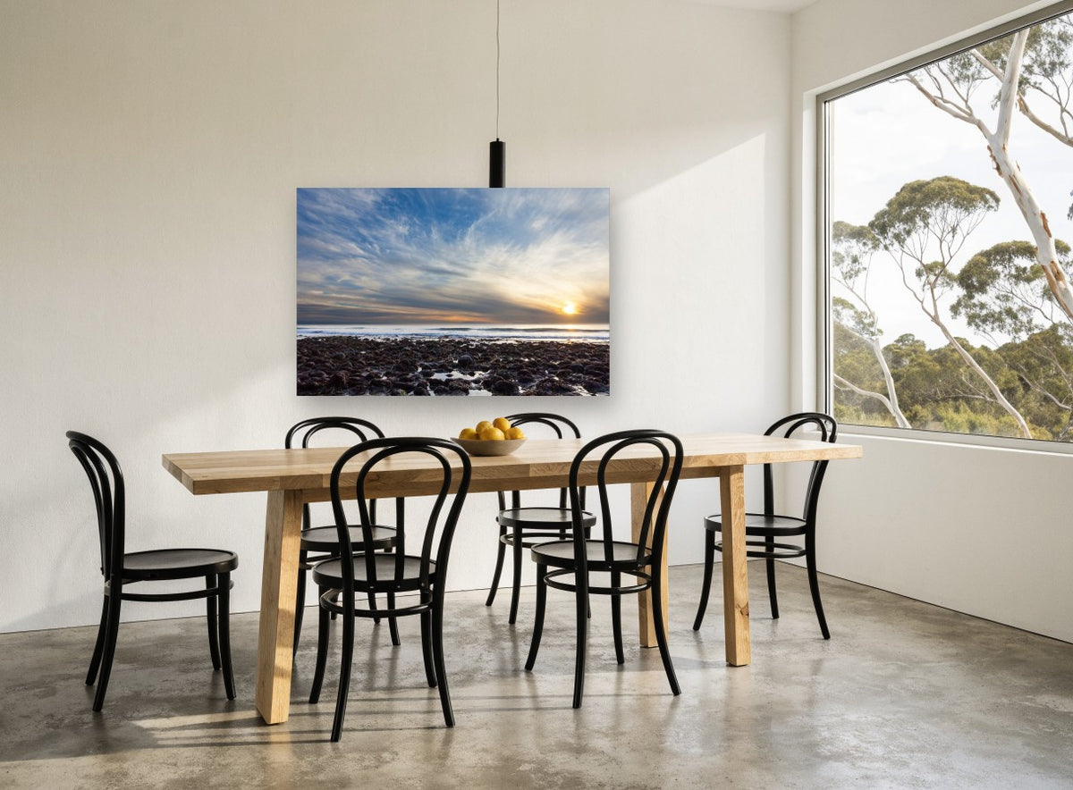 Low Tide Sunset Rocks coastal canvas print on the wall of a dining room