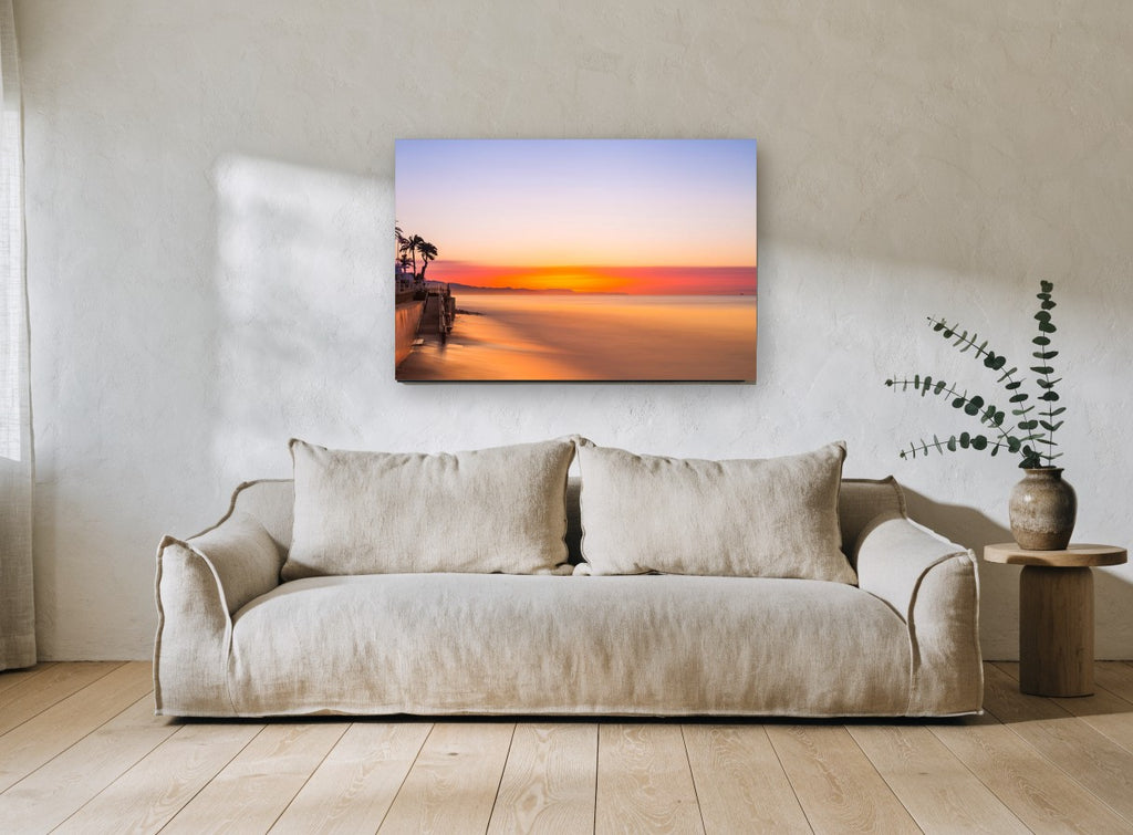 Glassy Dawn Shoreline coastal canvas print on the wall of a living room