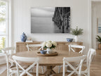 Quiet Pier Pilings coastal canvas print on the wall of a Hamptons dining room