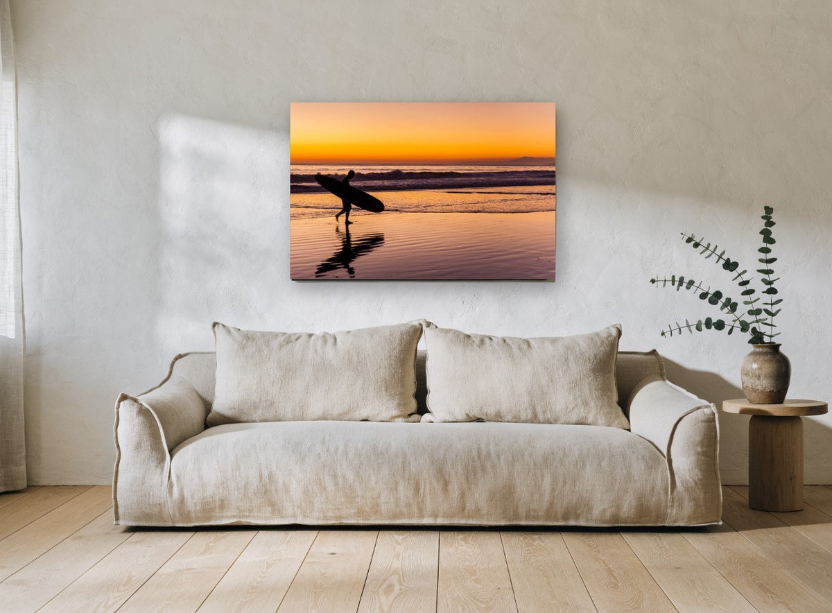 Surfer Heading Home coastal canvas print on the wall of a living room