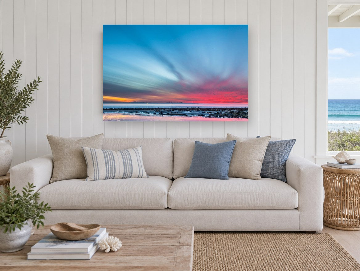 Streaked Dusk Over Low Tide coastal canvas print on the wall of a beach house living room