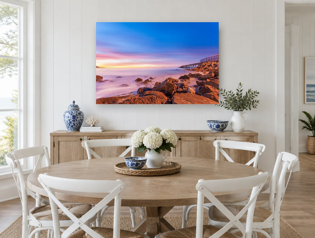 Dusk Over Rocky Shore coastal canvas print on the wall of a Hamptons dining room
