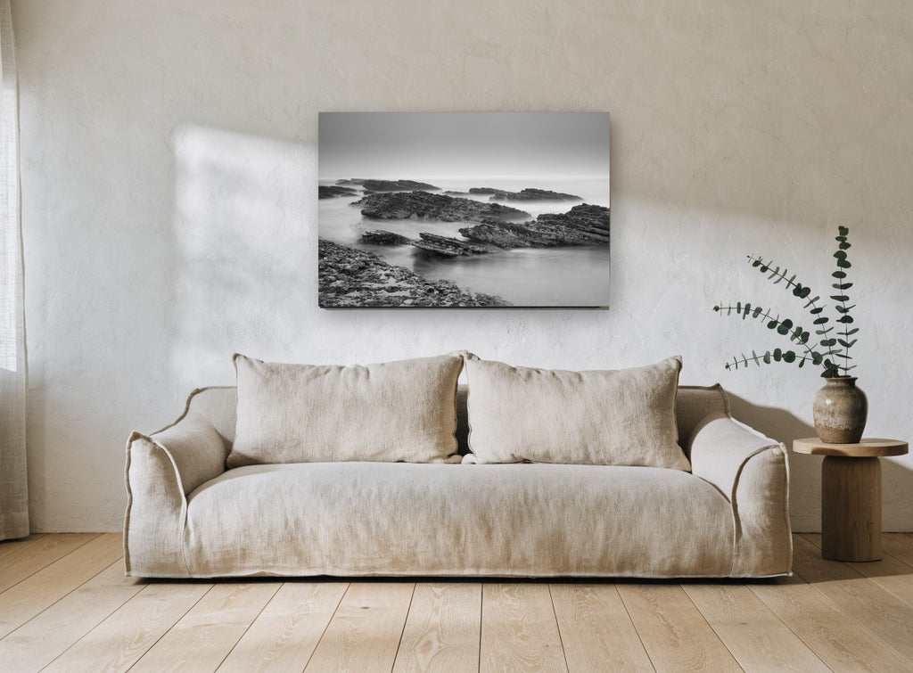 Misty Rock Shelves coastal canvas print on the wall of a living room