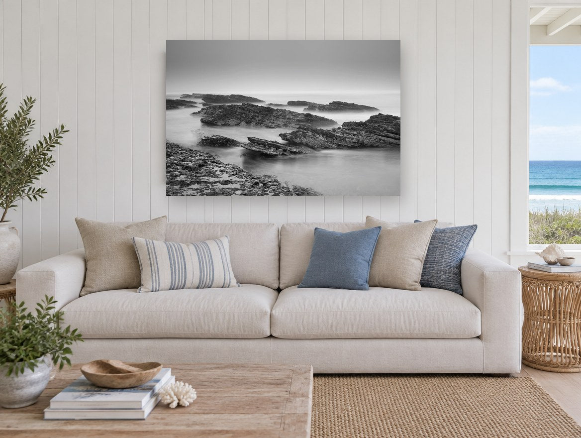 Misty Rock Shelves coastal canvas print on the wall of a beach house living room