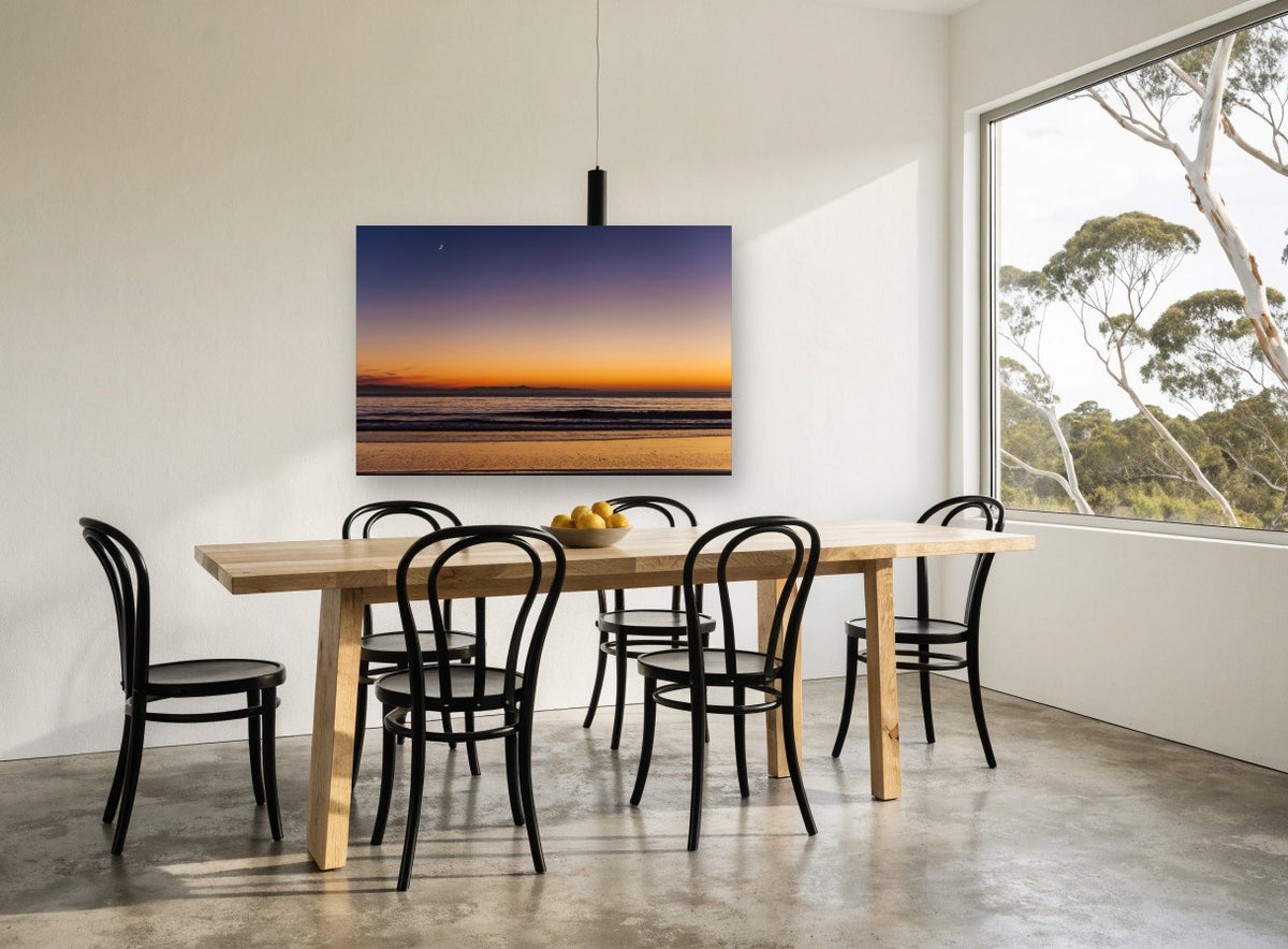 Crescent Moon Dusk coastal canvas print on the wall of a dining room