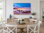 Dawn Glow Over Rocks coastal canvas print on the wall of a Hamptons dining room