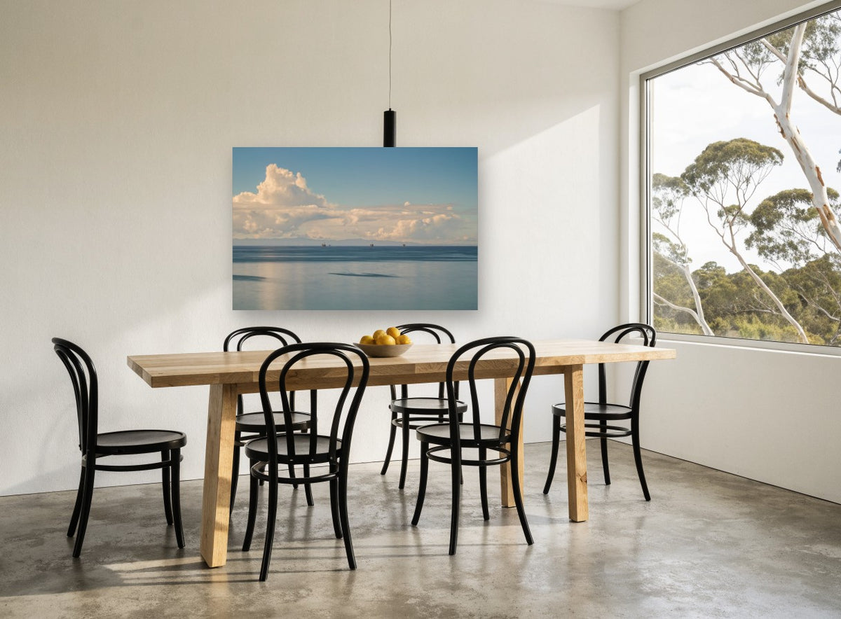 Calm Water Cloud Bank coastal canvas print on the wall of a dining room