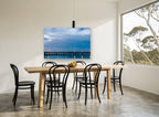 Blue Hour Pier coastal canvas print on the wall of a dining room