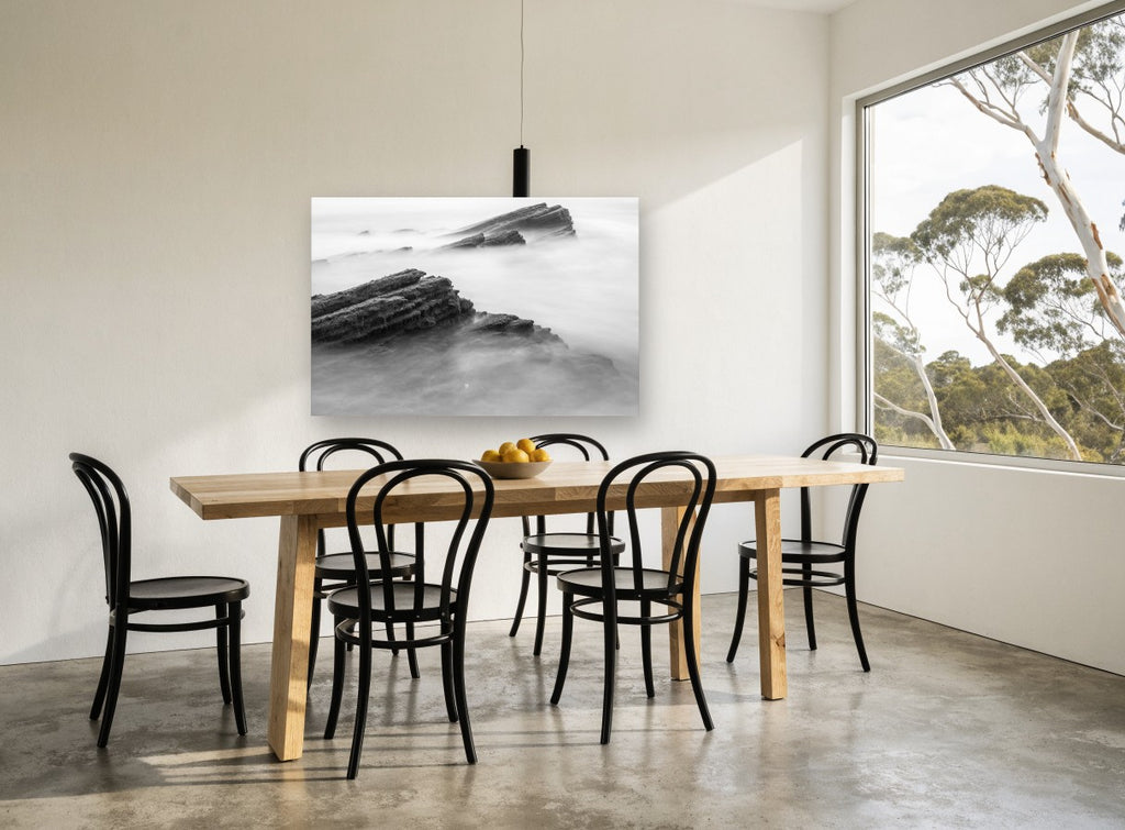 Misted Rock Ledges coastal canvas print on the wall of a dining room