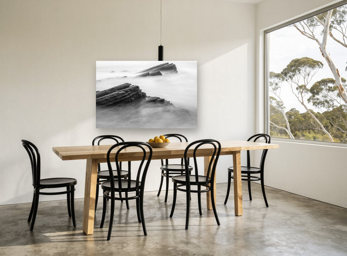 Misted Rock Ledges coastal canvas print on the wall of a dining room