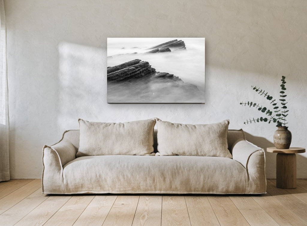 Misted Rock Ledges coastal canvas print on the wall of a living room