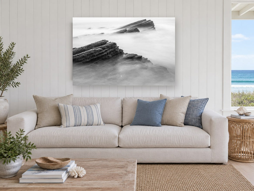 Misted Rock Ledges coastal canvas print on the wall of a beach house living room