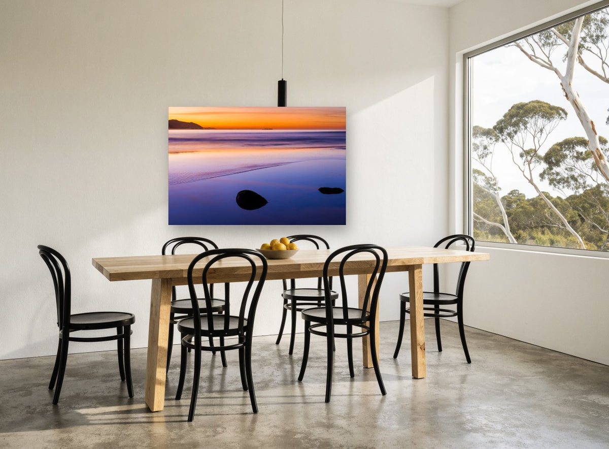 Dusk Reflections coastal canvas print on the wall of a dining room