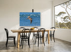 Curlew Over Blue Water animal canvas print on the wall of a dining room