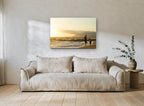 Golden Hour Shoreline Stroll coastal canvas print on the wall of a living room