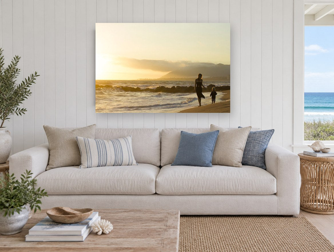 Golden Hour Shoreline Stroll coastal canvas print on the wall of a beach house living room