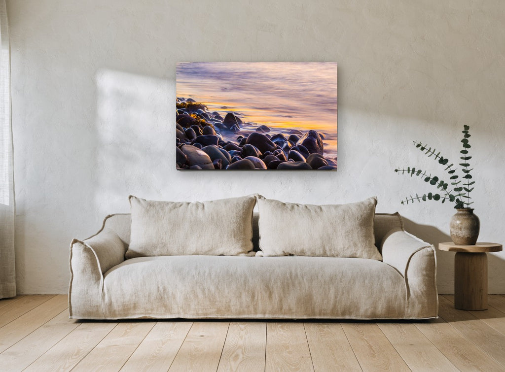 Dusk Pebble Shore coastal canvas print on the wall of a living room