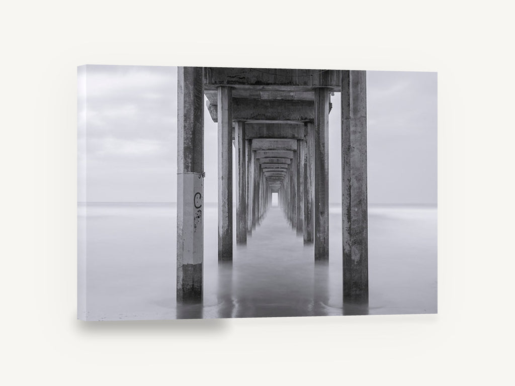 Silent Pier Corridor, pier pilings black and white photograph, coastal canvas wall art print ready to hang