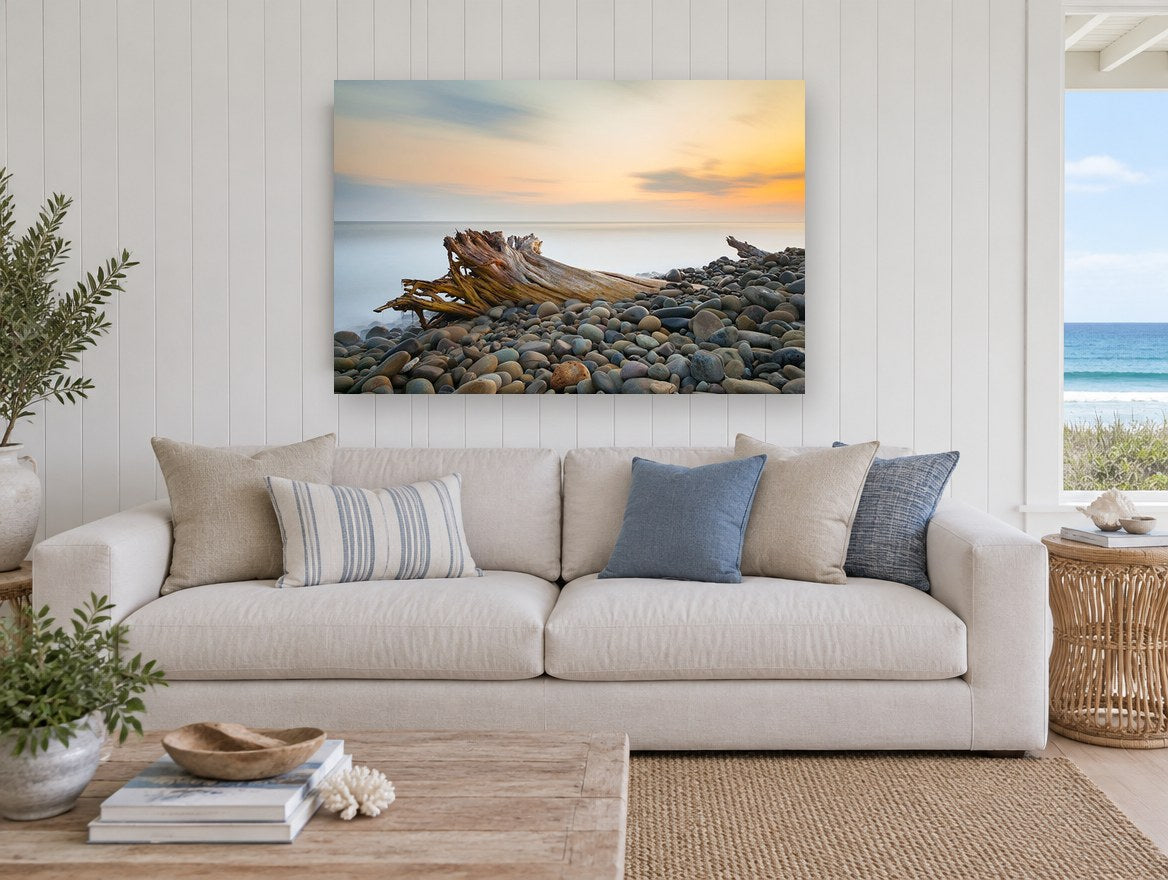 Driftwood at Dusk coastal canvas print on the wall of a beach house living room