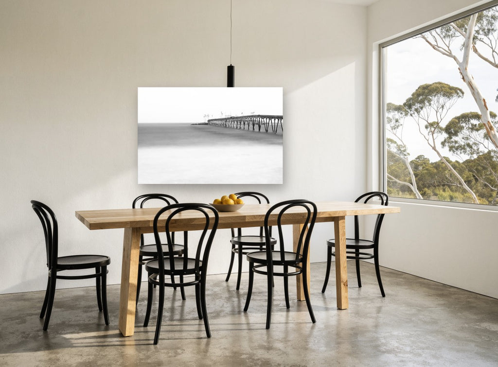 Misted Pier Horizon coastal canvas print on the wall of a dining room