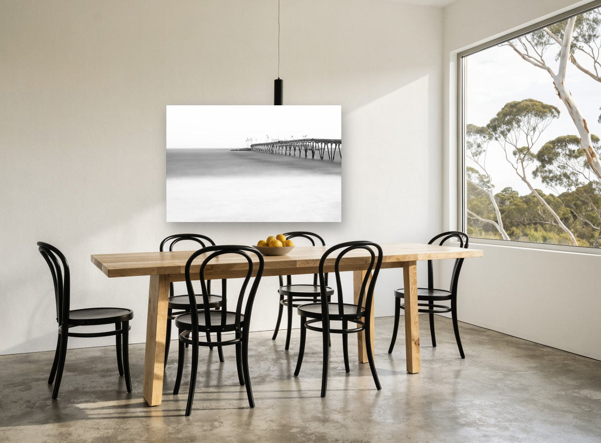 Misted Pier Horizon coastal canvas print on the wall of a dining room