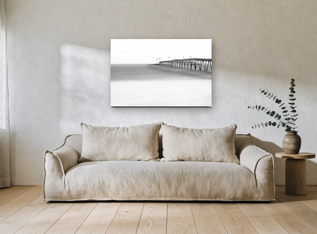Misted Pier Horizon coastal canvas print on the wall of a living room